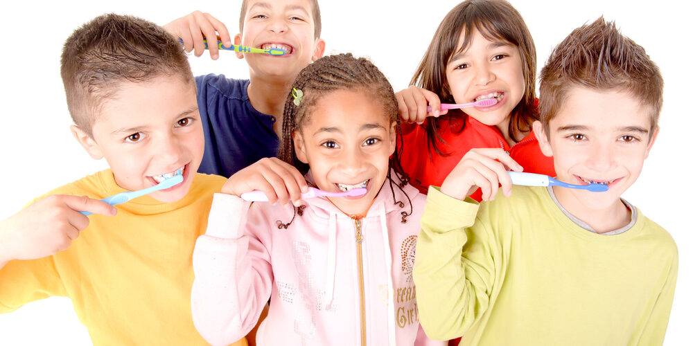 kids with toothbrushes