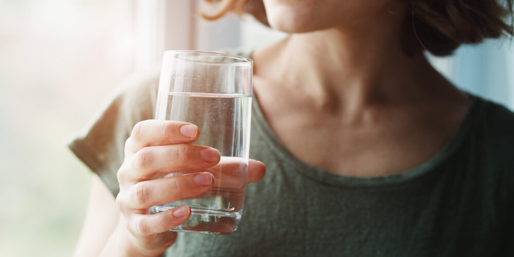 Healthy Beautiful Young Woman Holding Glass Of Water